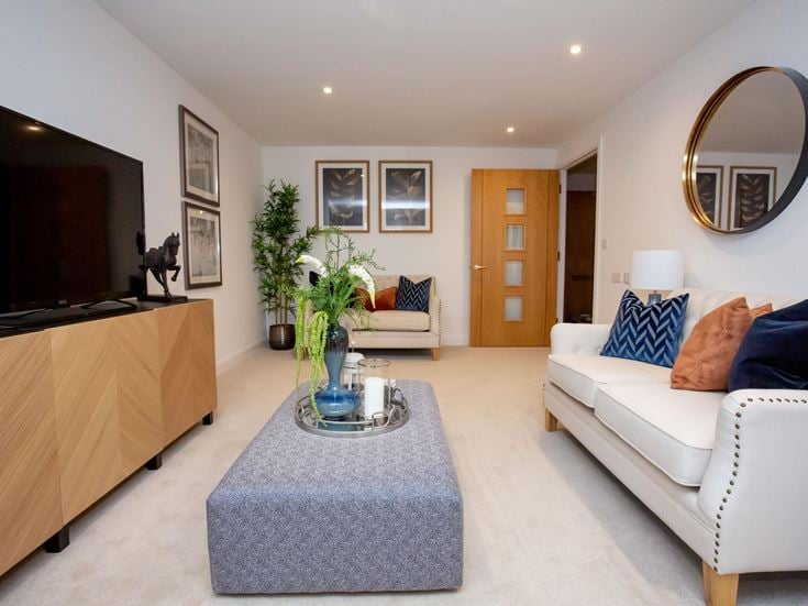 a living room with a couch and a table
