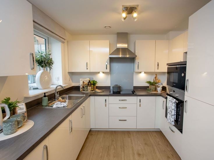 a kitchen with white cabinets