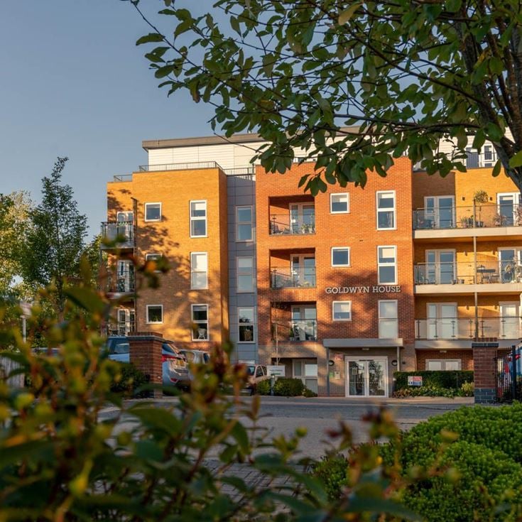 a building with trees in front