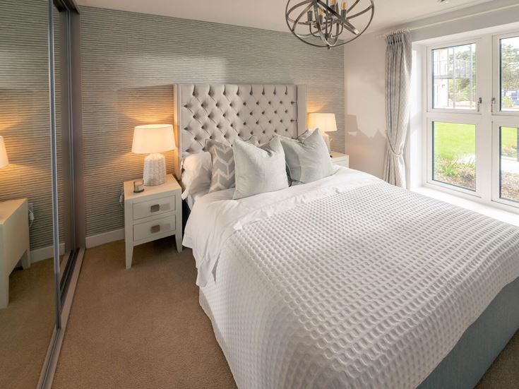 a bed with a white bed spread