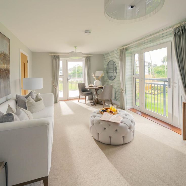 a living room with a large glass door