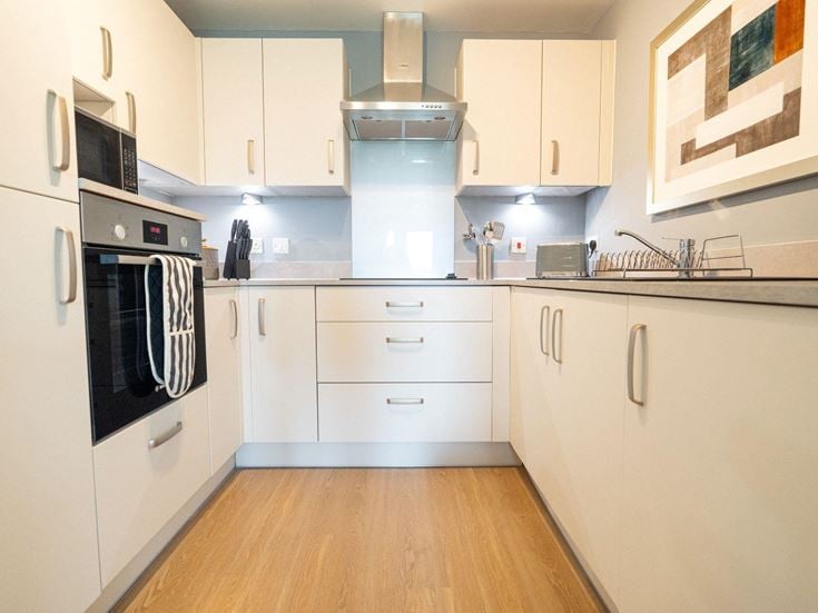 a kitchen with white cabinets