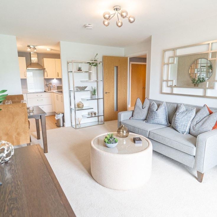 a living room with a couch and a table
