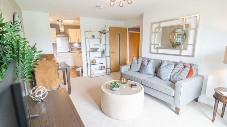 a living room with a couch and a table