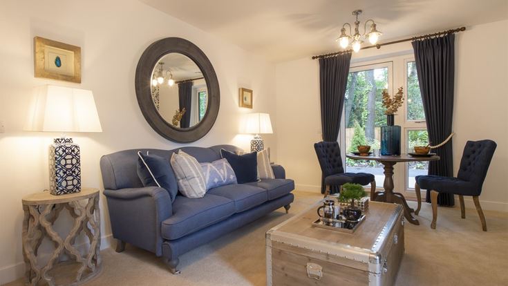 a living room with a blue couch
