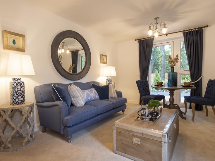 a living room with a blue couch