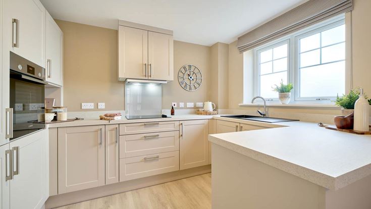a kitchen with white cabinets
