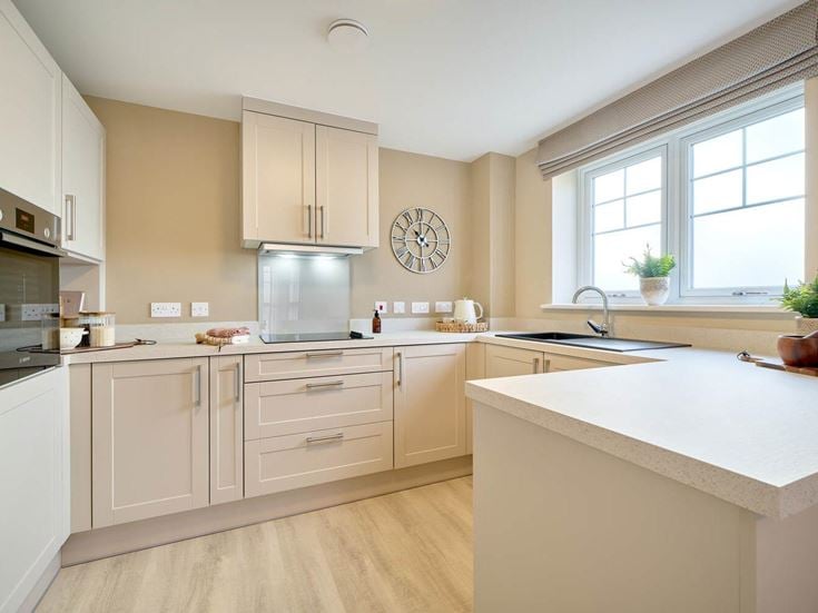 a kitchen with white cabinets