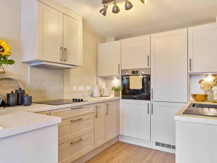 a kitchen with white cabinets
