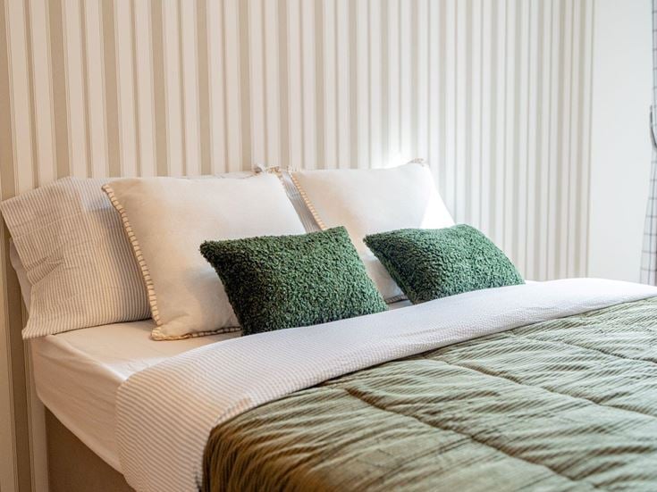 a bed with pillows