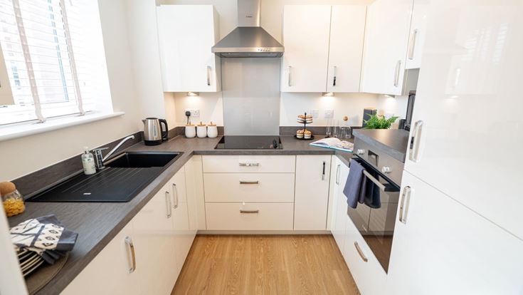 a kitchen with white cabinets