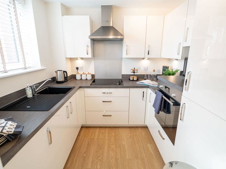 a kitchen with white cabinets