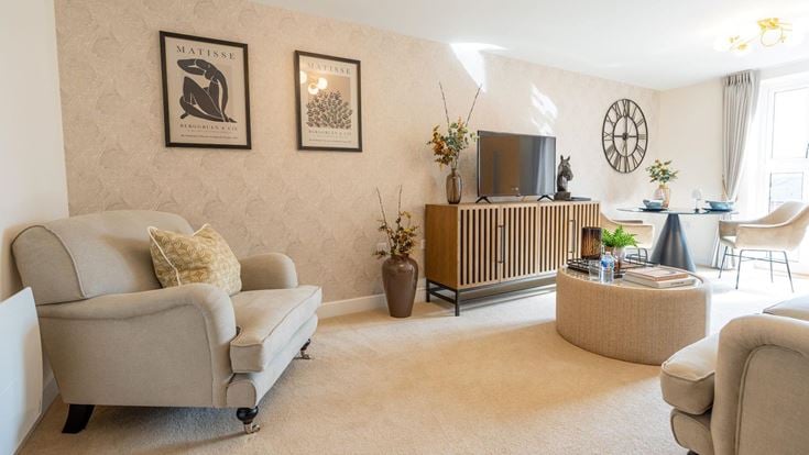 a living room with a tv and couches