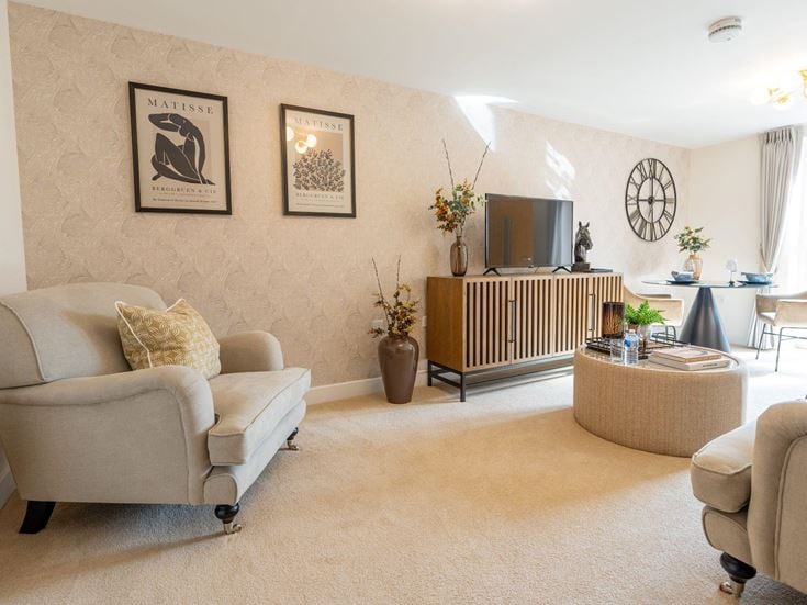 a living room with a tv and couches