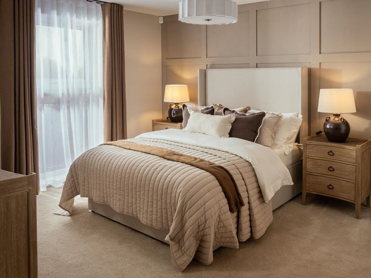 a bed with a white bed spread