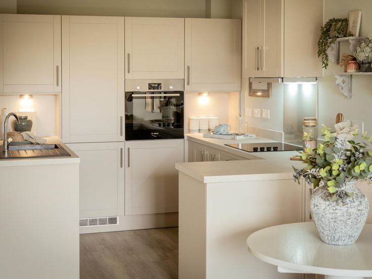 a kitchen with white cabinets