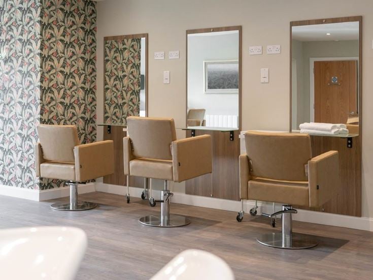 a room with chairs and a table