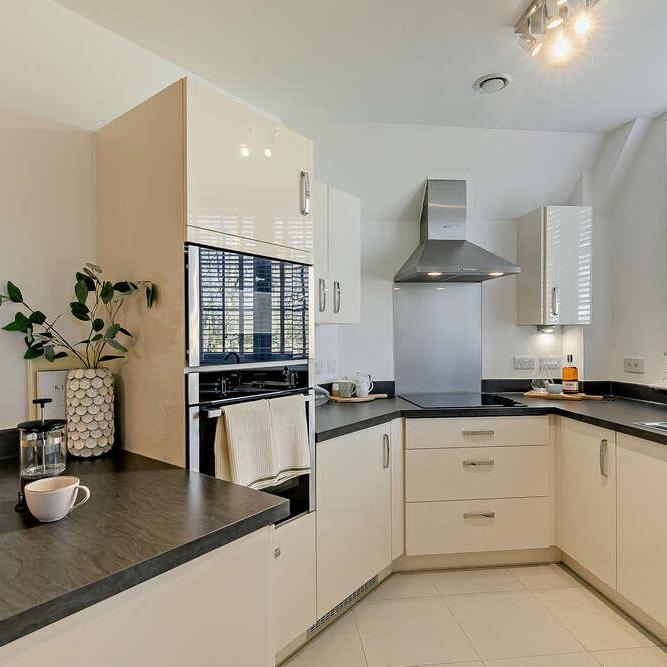 a kitchen with white cabinets