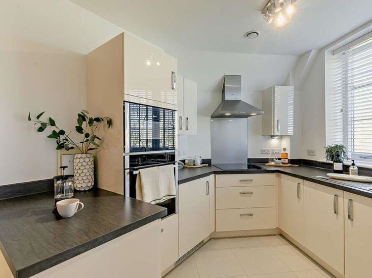 a kitchen with white cabinets