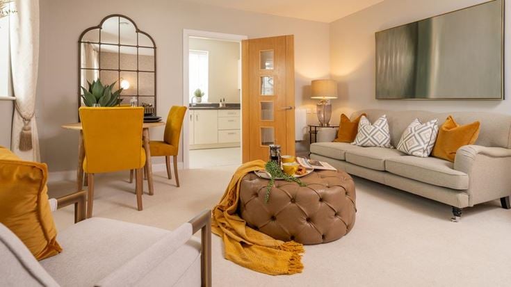 a living room with a couch and a table