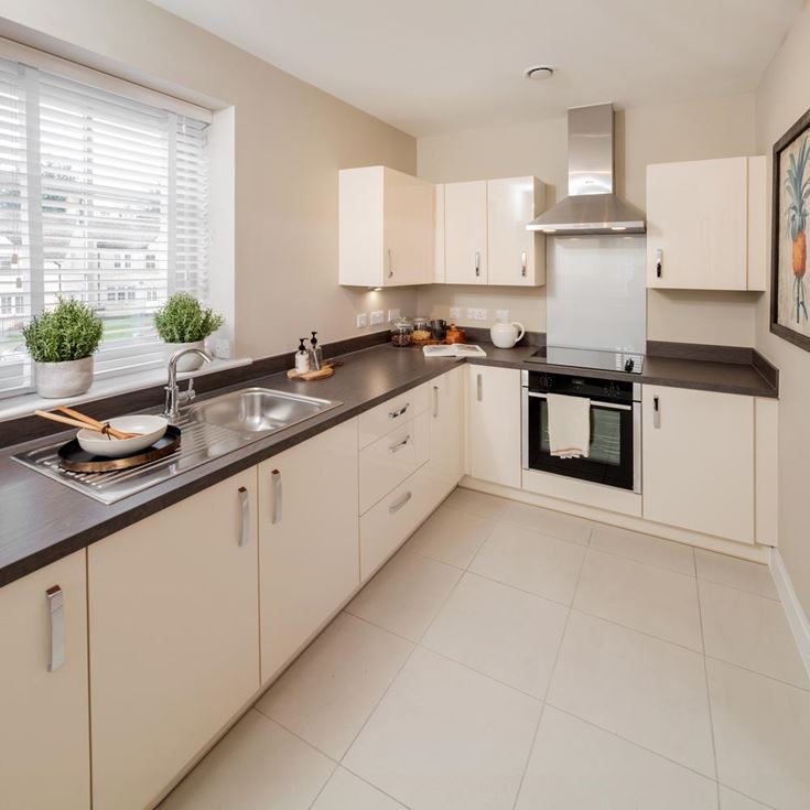 a kitchen with white tile