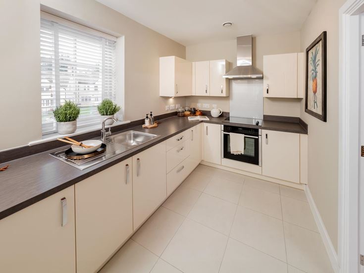 a kitchen with white tile