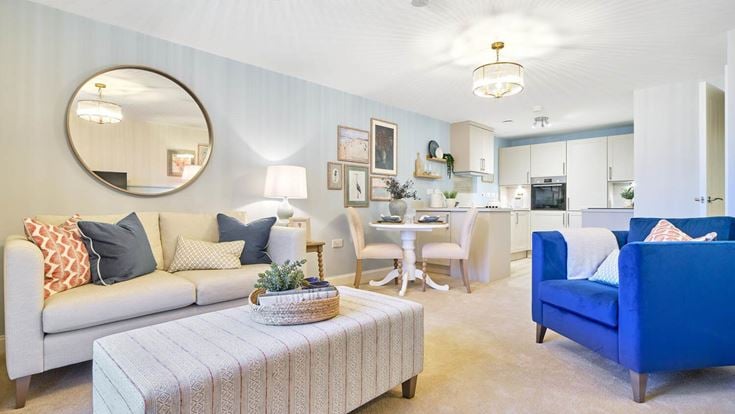 a living room with a couch and a table