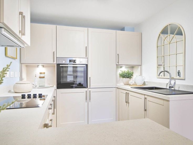 a kitchen with white cabinets