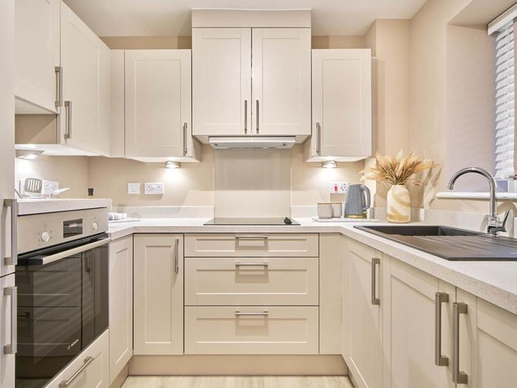 a kitchen with white cabinets