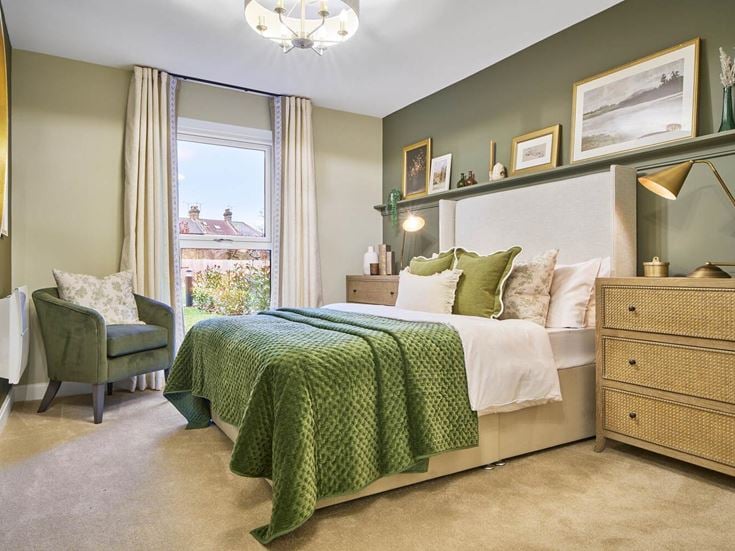 a bedroom with a bed and a chair