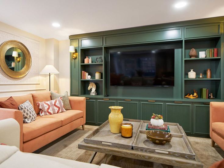 a living room with a tv and couches