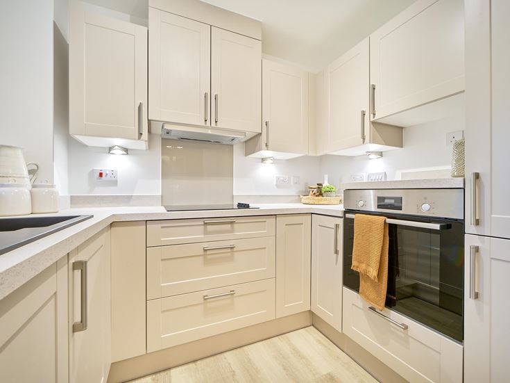 a kitchen with white cabinets