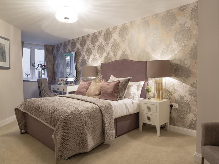 a bedroom with a bed and a chair