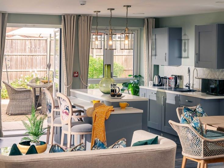 a kitchen with a table and chairs