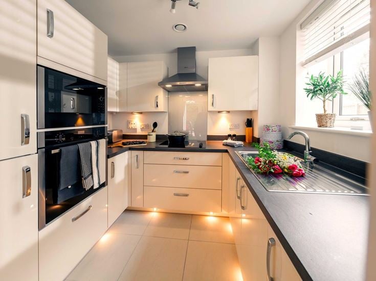 a kitchen with white cabinets