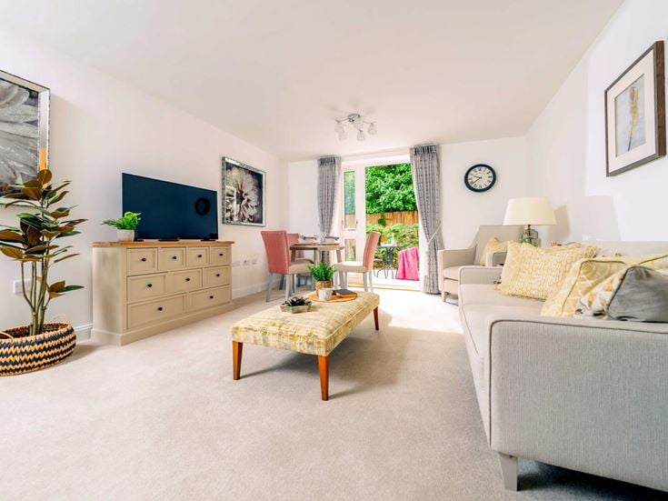 a living room with a bed and a couch