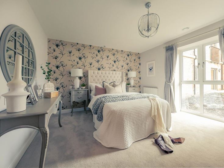 a bedroom with a large mirror