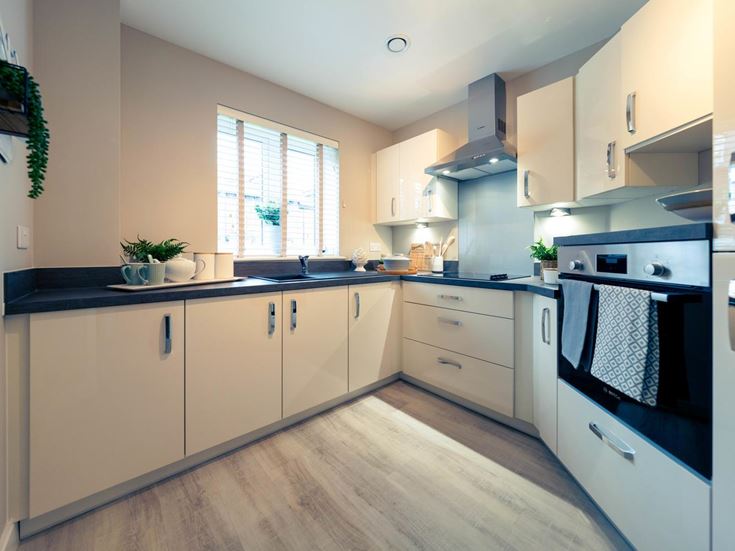 a kitchen with white cabinets