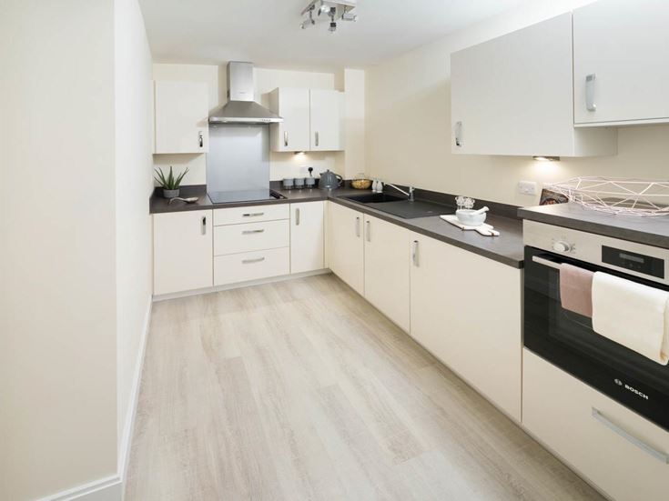 a kitchen with white cabinets
