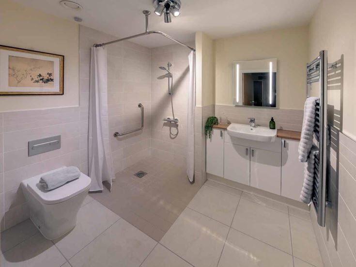 a bathroom with a shower and toilet
