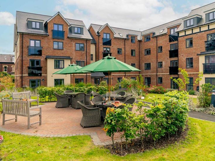 a courtyard with tables and chairs