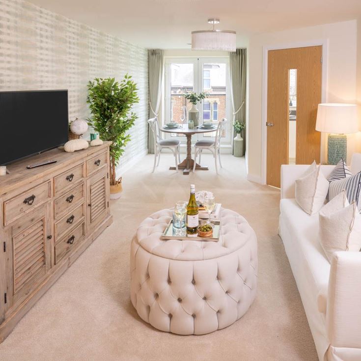 a living room with a tv and couches
