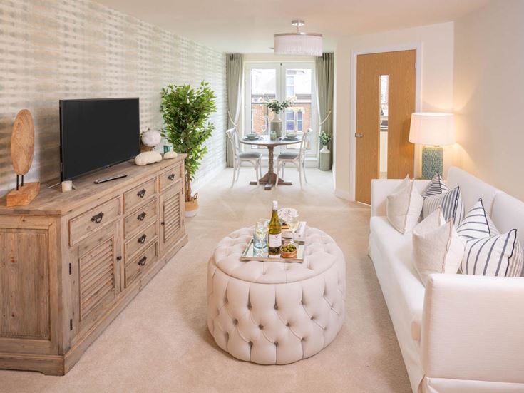 a living room with a tv and couches