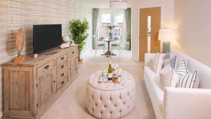 a living room with a tv and couches
