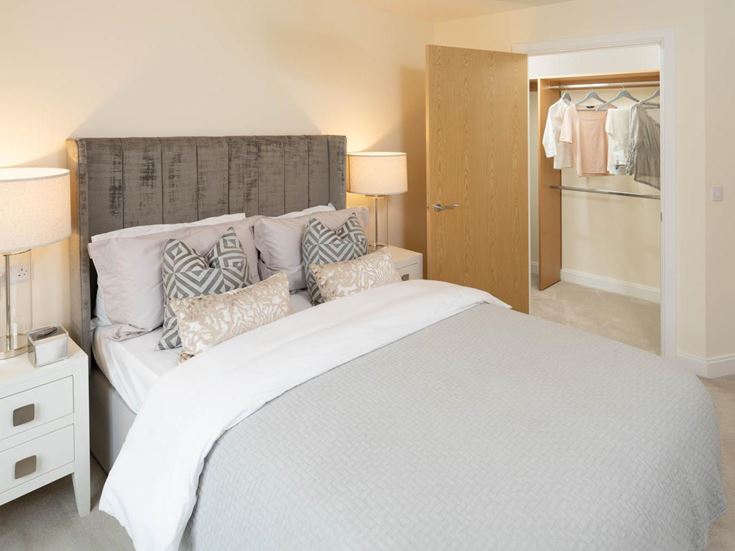 a bed with a white bed spread