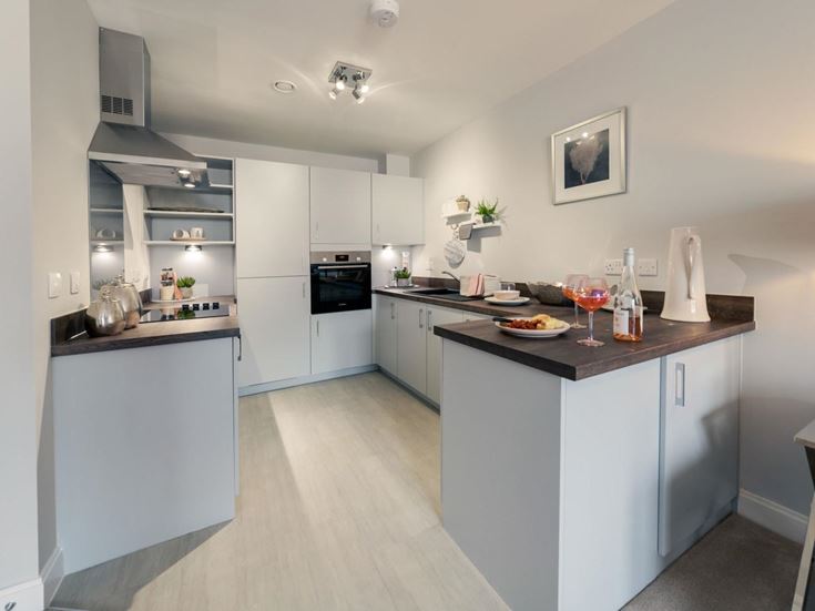 a kitchen with white cabinets