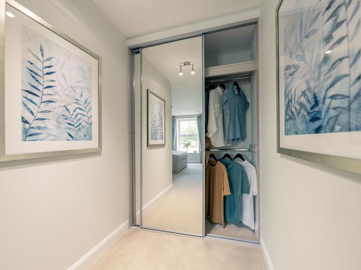 a room with a door and a mirror