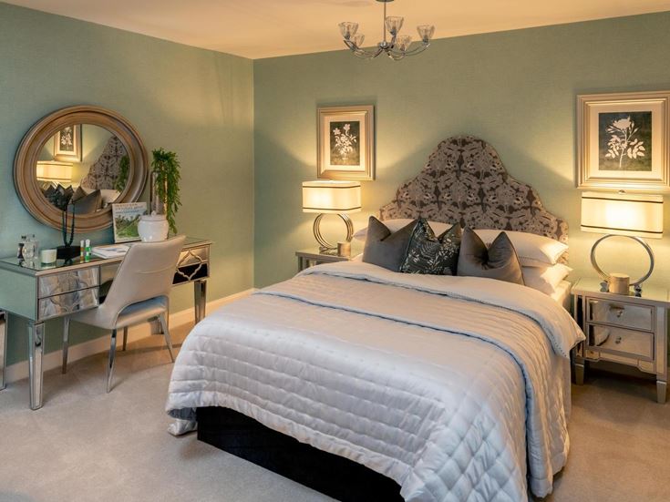 a bedroom with a large mirror