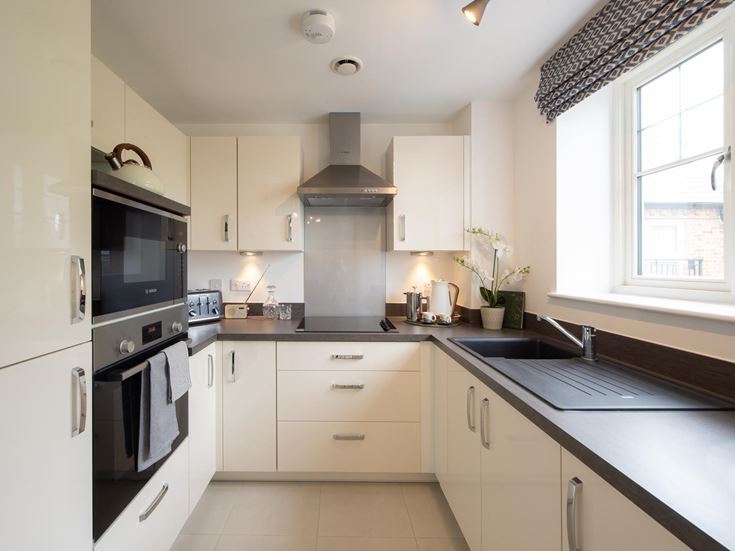 a kitchen with white cabinets