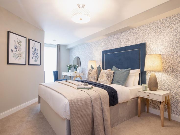 a bedroom with a bed and a desk